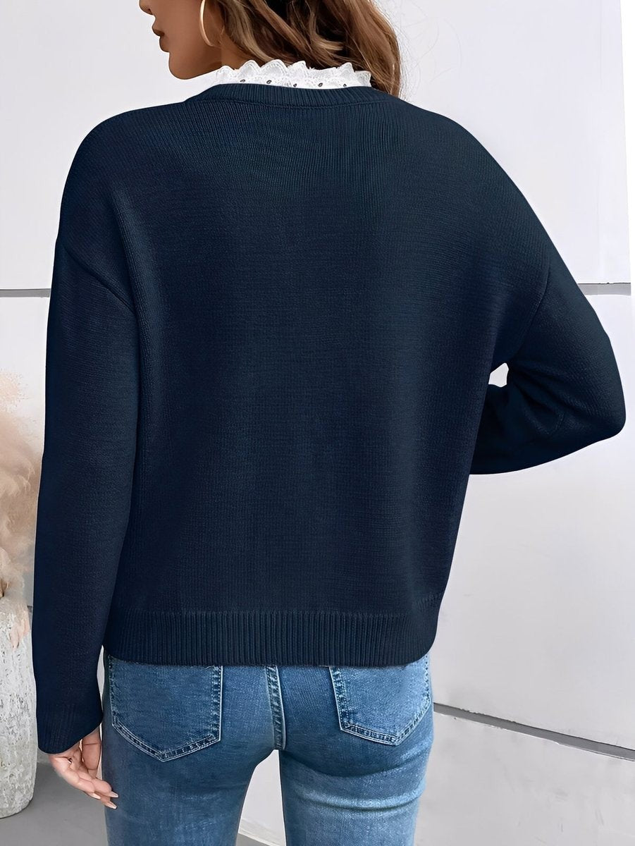 back view of navy lace-trim knit sweater with dropped shoulders