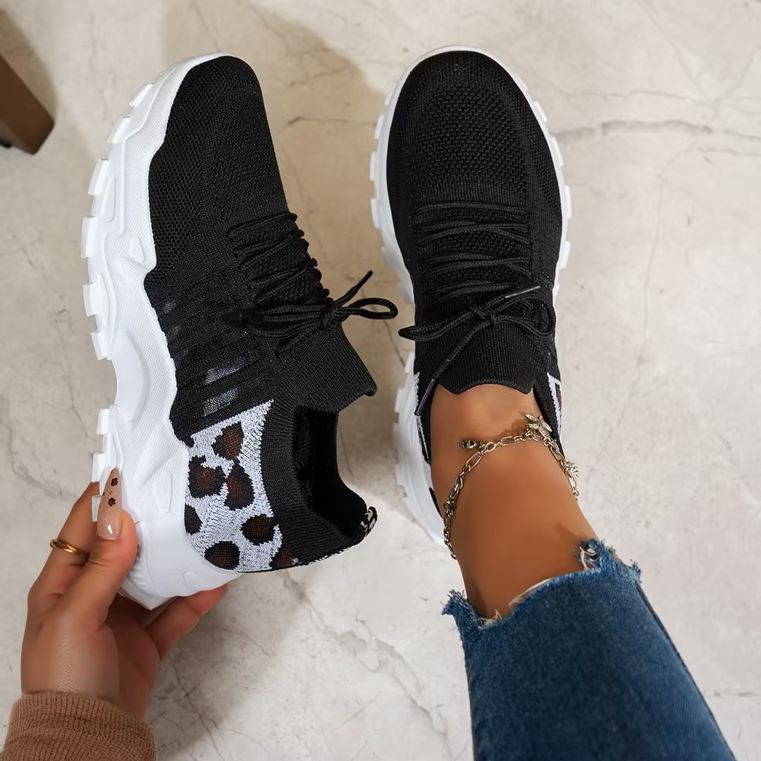 Black knit sneakers with leopard print panel and white platform sole