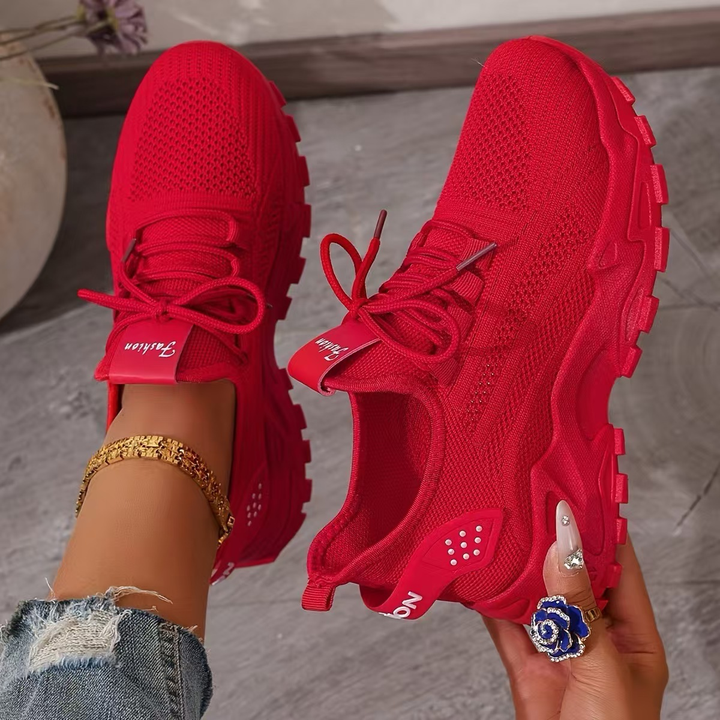 Red knit lace-up sneakers with chunky white-textured tread outsole