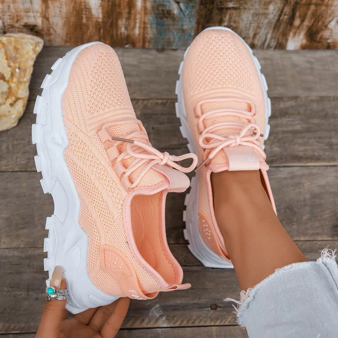 Peach knit chunky sneakers with white platform sole and lace-up front