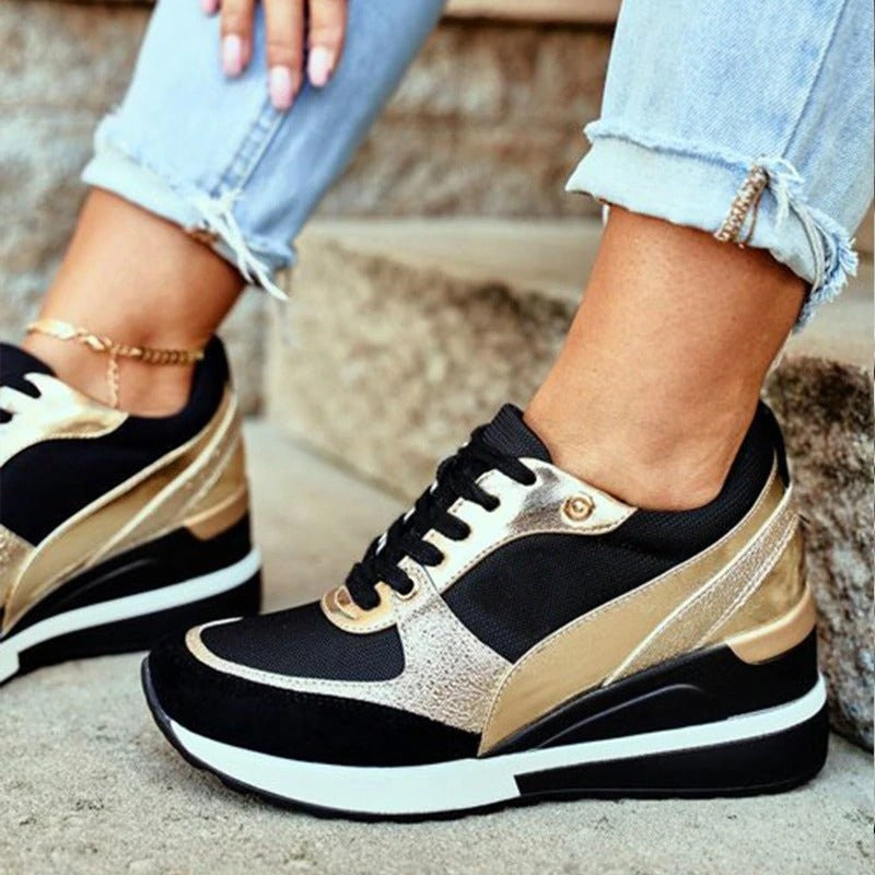 black mesh sneakers with gold metallic panels and lace-up front