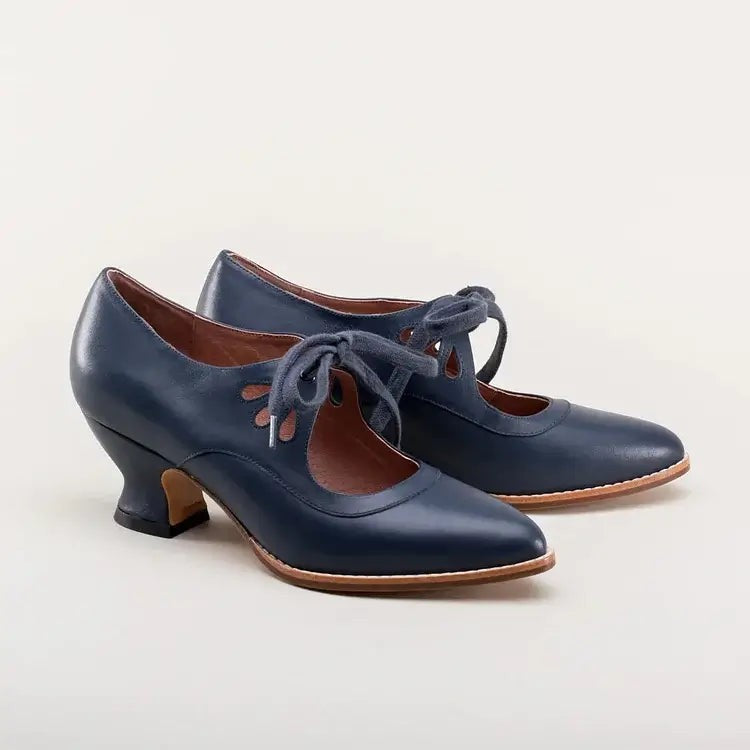 Navy blue leather lace-up pumps with spool heel, product shot
