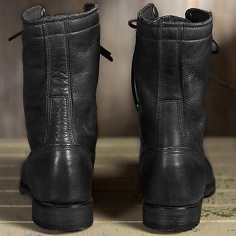 back view of black leather lace-up boots showing heel and stitching detail