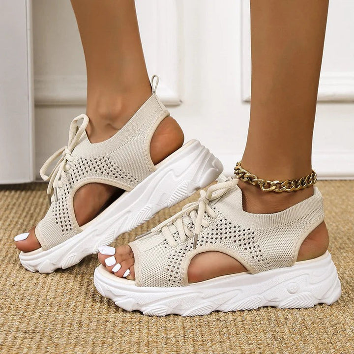 Beige knit peep-toe sandals with lace-up closure and thick white platform