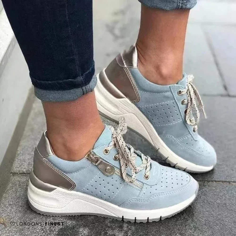 Light blue suede lace-up sneakers featuring wedge sole and metallic trim