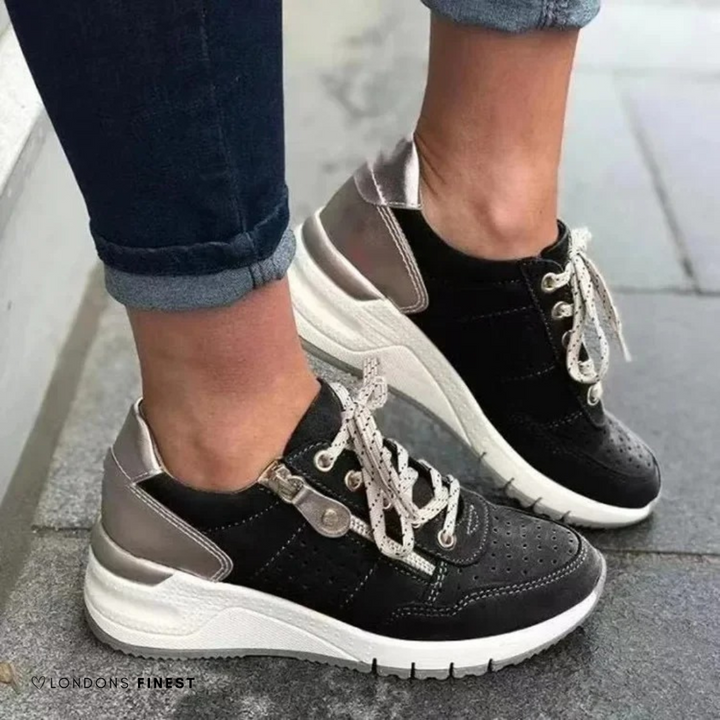 Black suede lace-up sneakers with metallic heel panel and platform sole
