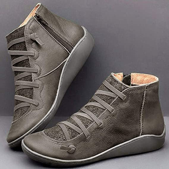 Gray leather ankle boots with woven lace detailing and side zipper