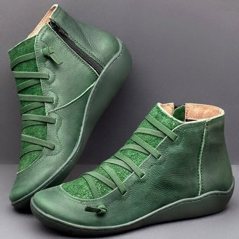 Green leather ankle boots with crisscross lacing and rubber wedge sole