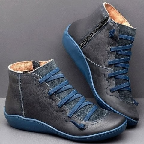 Navy blue leather ankle boots with contrast sole and lace-up front