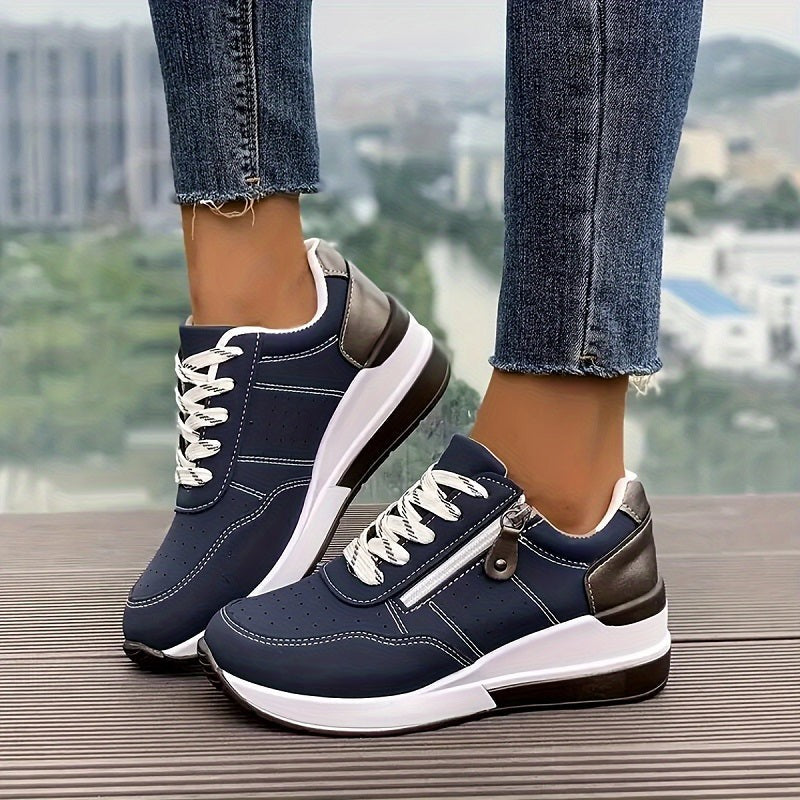 Navy blue wedge sneakers with lace-up front and side zipper detail