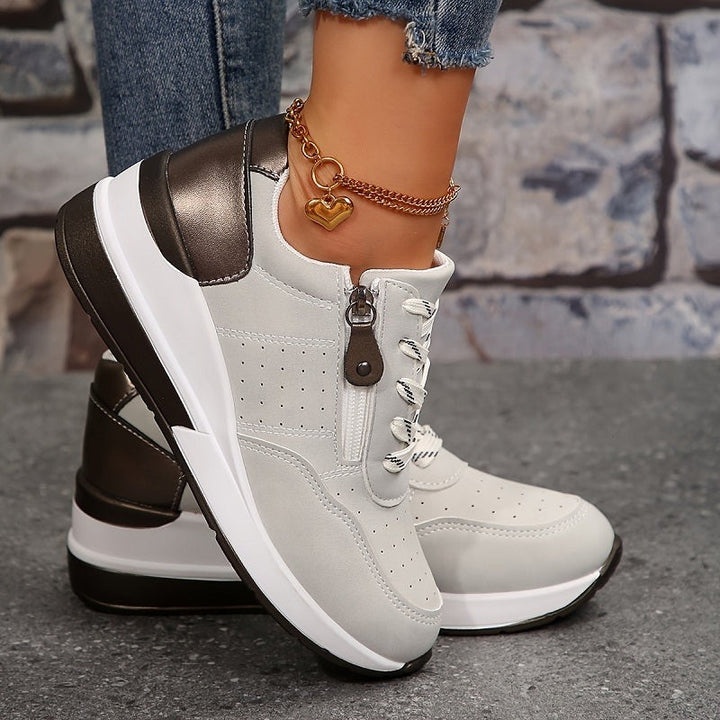 Gray wedge sneakers with side zipper, lace-up front, and chunky sole