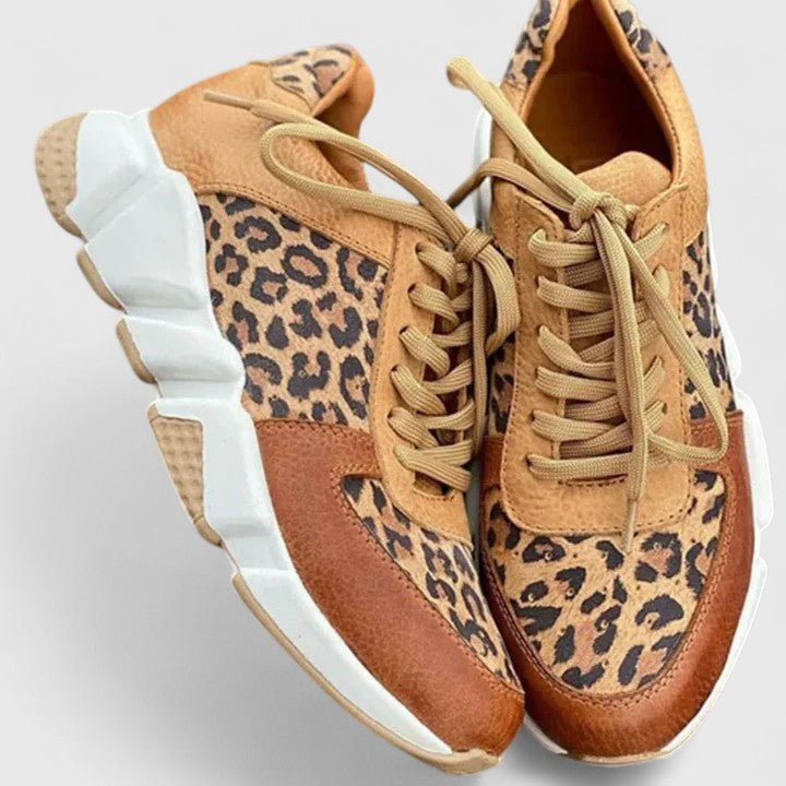 pair of leopard-print chunky sneakers with white platform sole and tan laces