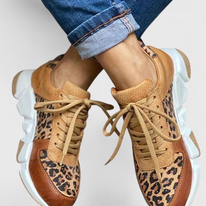 cuffed jeans paired with tan and leopard-print chunky platform sneakers