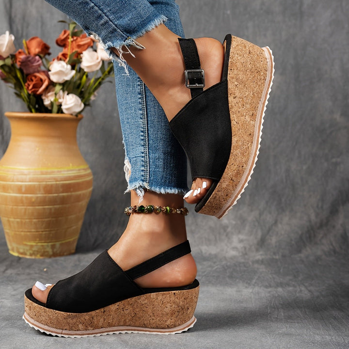 black suede wedge sandals with cork platform sole and slingback buckle