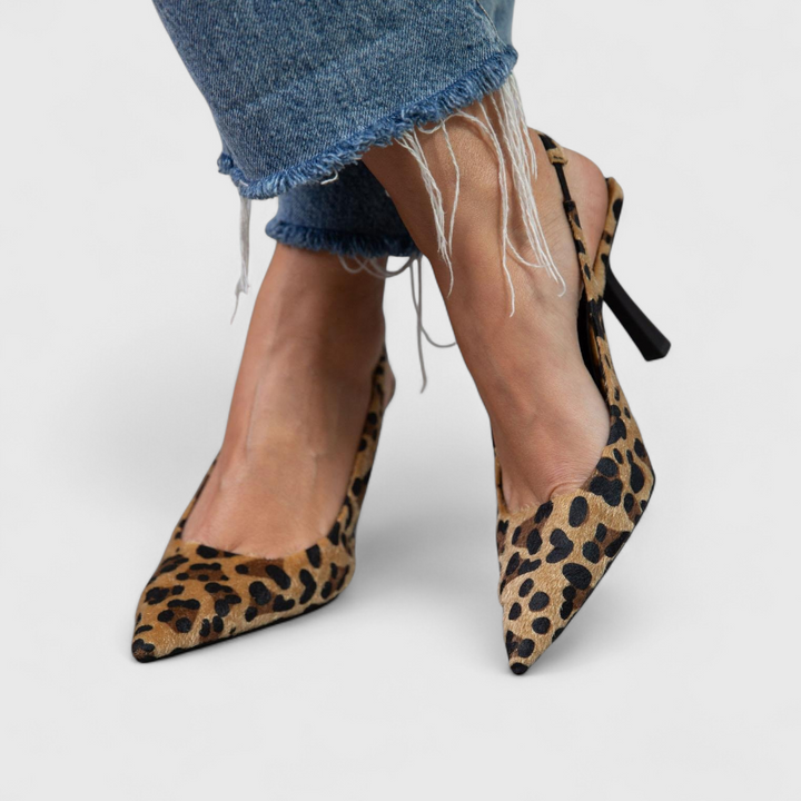 pointed-toe leopard print pumps featuring slingback strap and slim heel