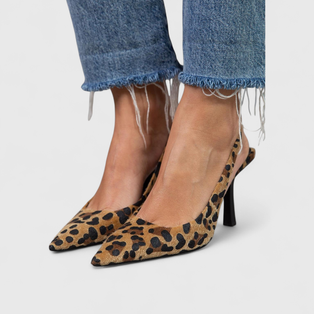 leopard print stiletto pumps paired with cropped raw-hem jeans