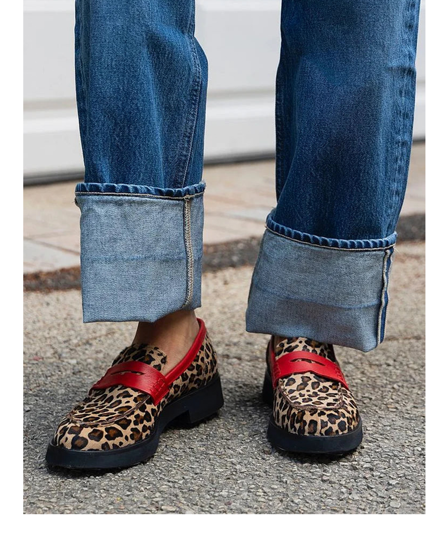 Leopard print penny loafers with red leather strap and cuffed jeans