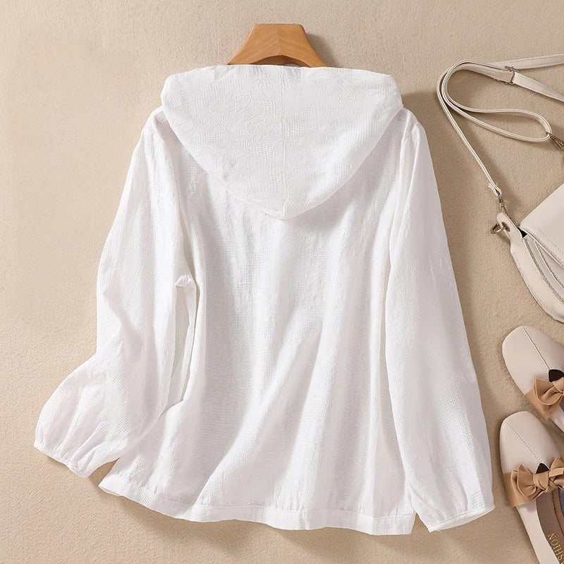 white hooded shirt back view with elastic cuffs and textured weave