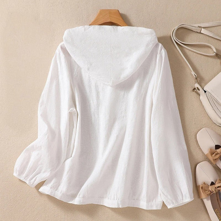 white hooded shirt back view with elastic cuffs and textured weave