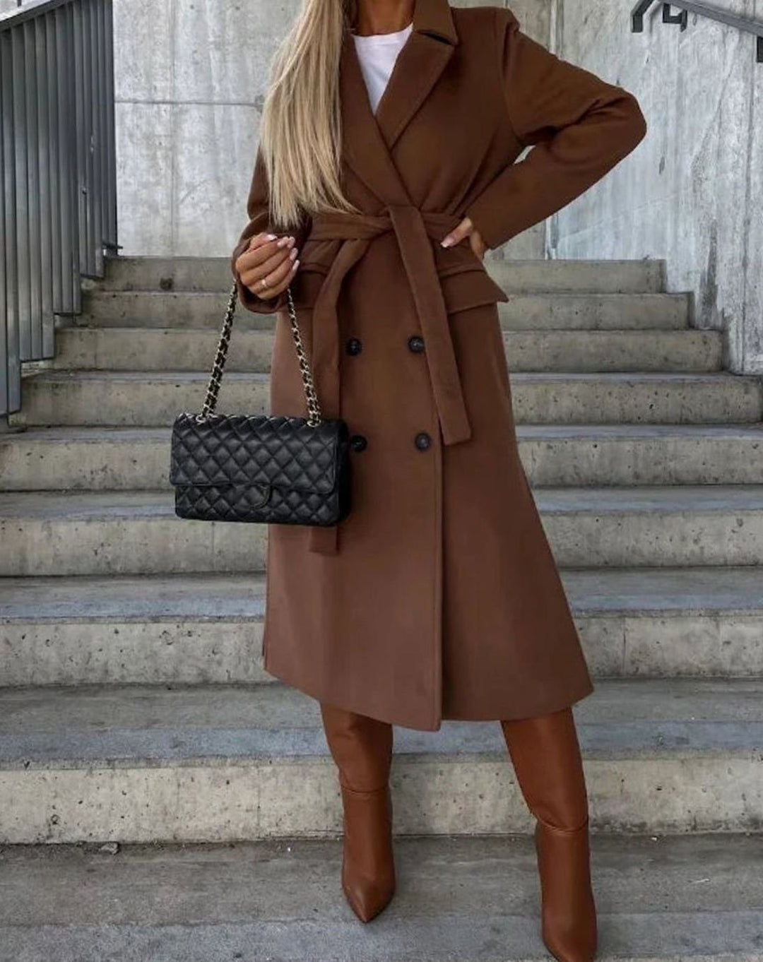 Chestnut brown belted longline coat paired with matching leather boots