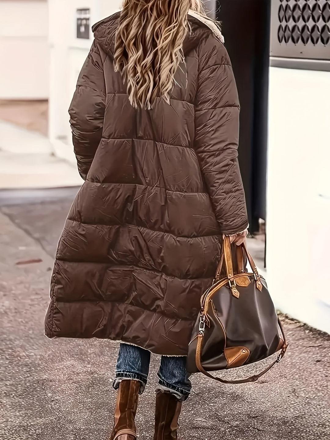 Back view of dark brown long puffer coat with hood and quilted detailing