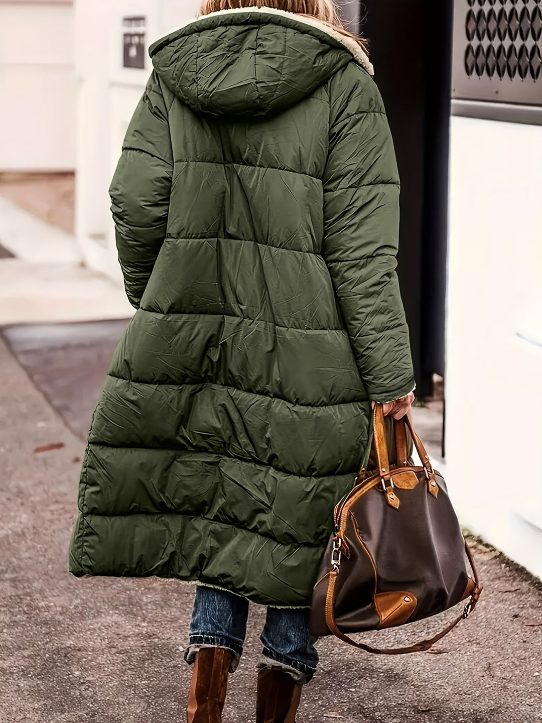 Back view of olive green long puffer coat with hood and quilted panels