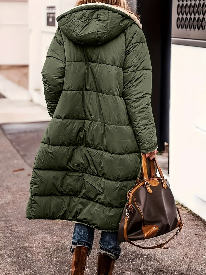 Back view of olive green long puffer coat with hood and quilted panels