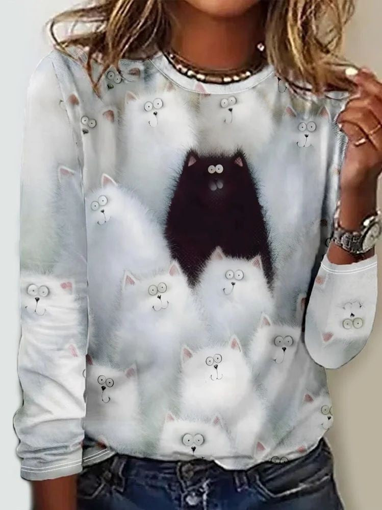 gray long-sleeve top with fluffy white and black cat print