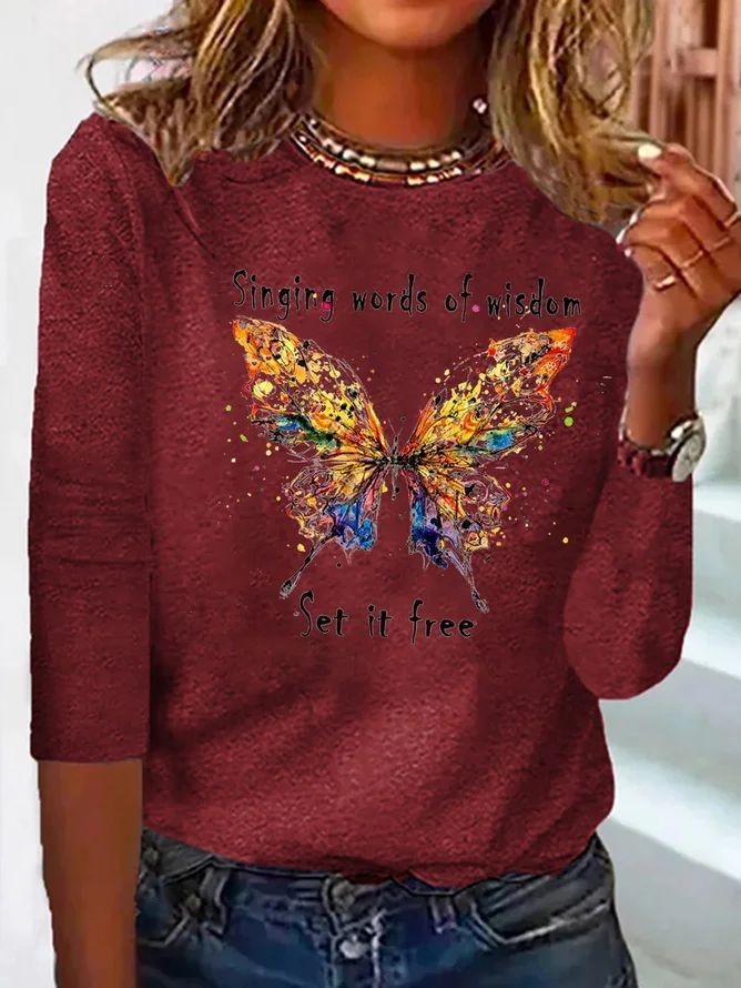 burgundy long-sleeve tee with colorful butterfly graphic and quote text