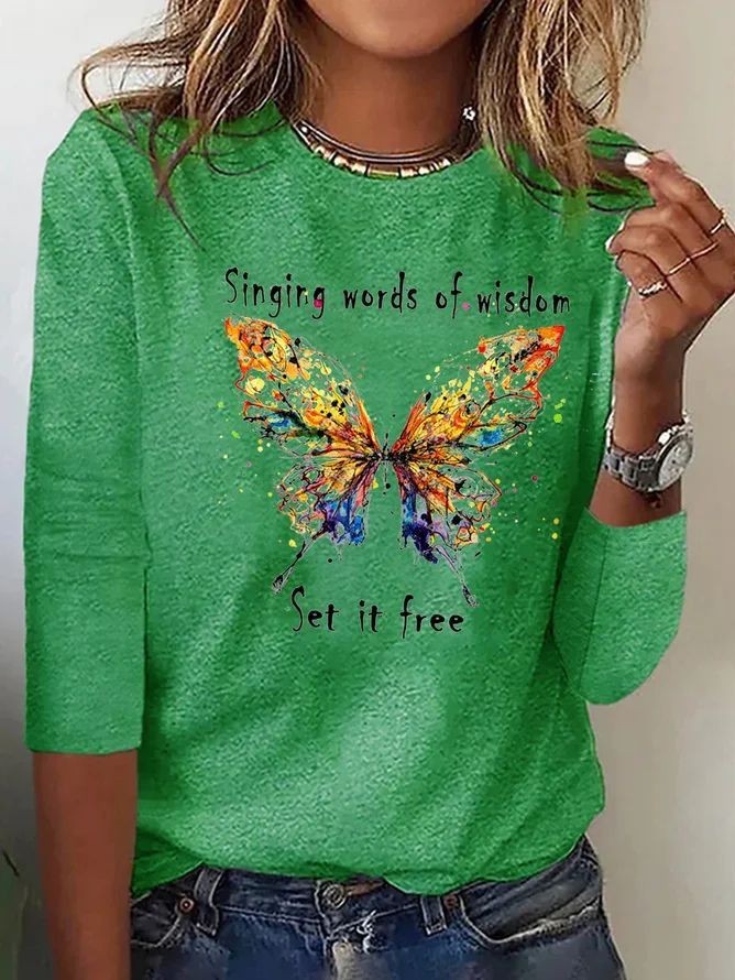 green long-sleeve tee with watercolor butterfly print and quote text