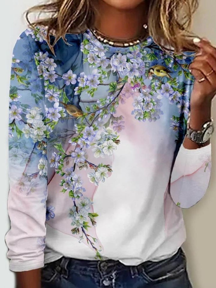 white long-sleeve top with pastel floral branch and bird print
