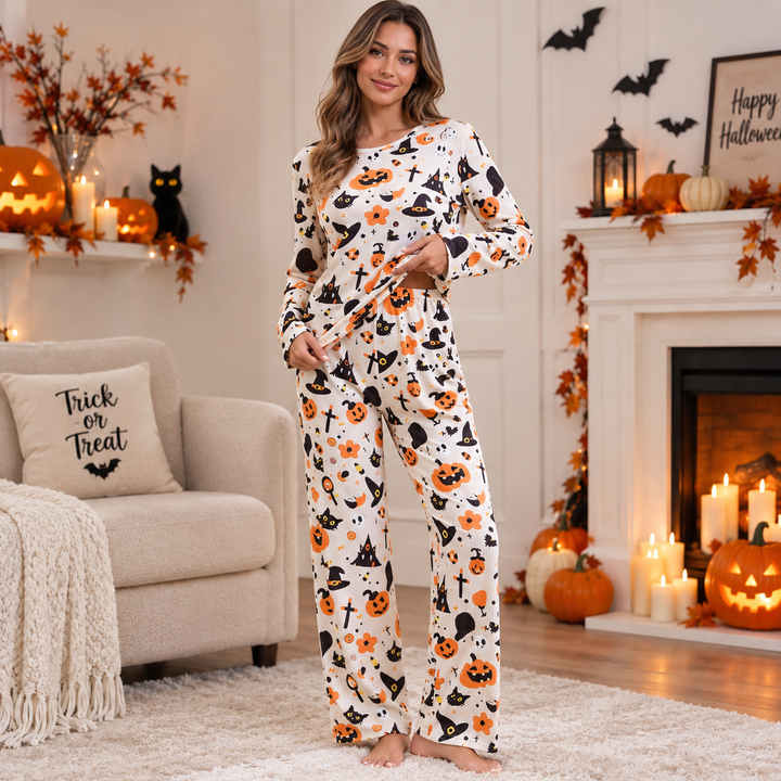 woman wearing cream pajama set with Halloween pumpkin and witch hat print