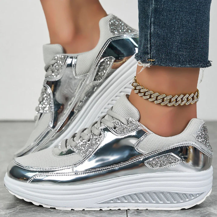 Metallic silver platform sneakers with rhinestone glitter panels and chunky sole