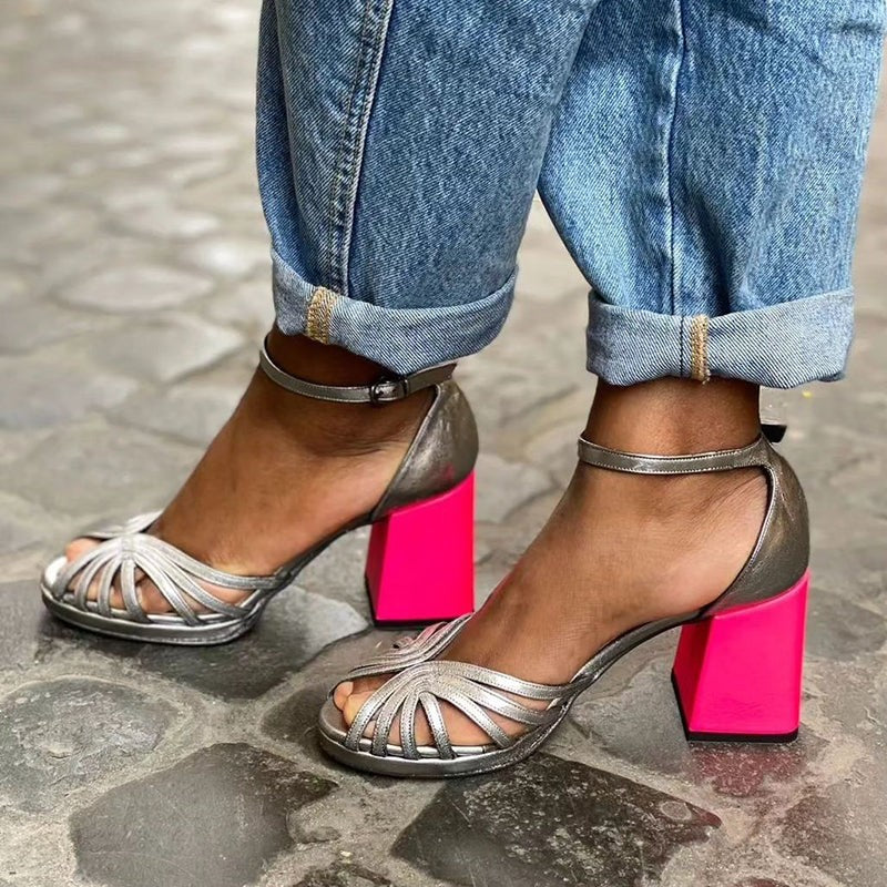 Metallic silver ankle-strap sandals with chunky hot pink block heel