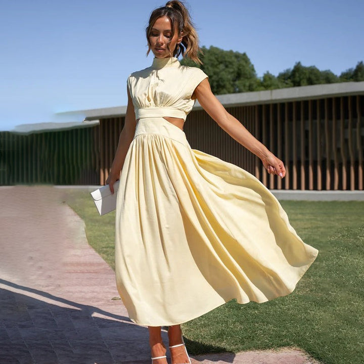 Pale yellow cutout maxi dress swaying with pleated a-line skirt