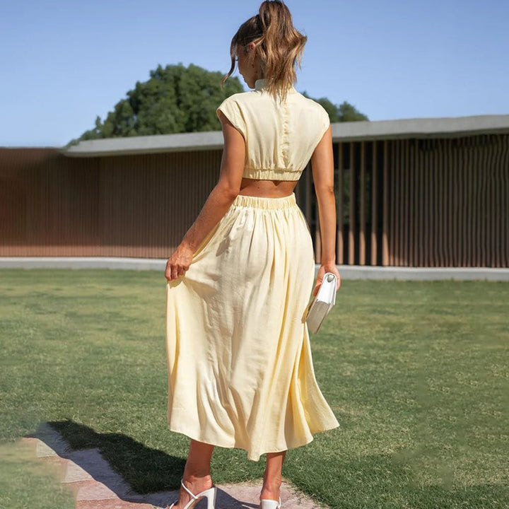 Back view of pale yellow cutout maxi dress with elastic waistband