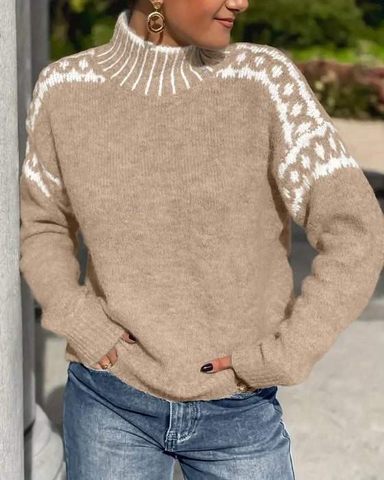 beige mock neck sweater featuring white leopard pattern on sleeves