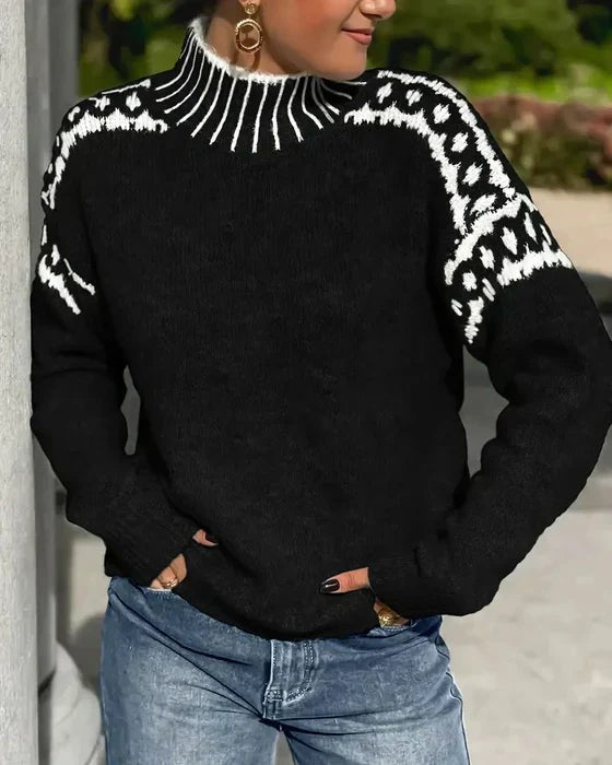 black mock neck sweater with white leopard print shoulder trim