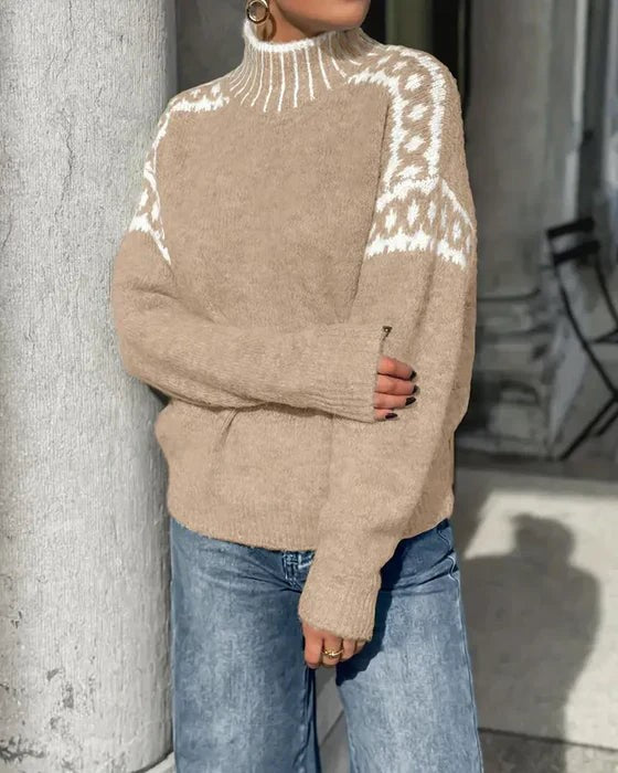 beige cozy sweater with white leopard knit pattern on shoulders