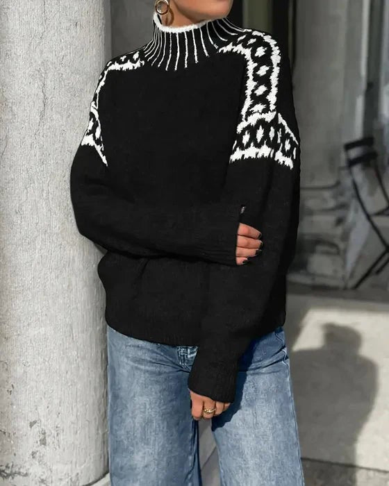 black cozy sweater featuring white leopard print knit shoulder accent