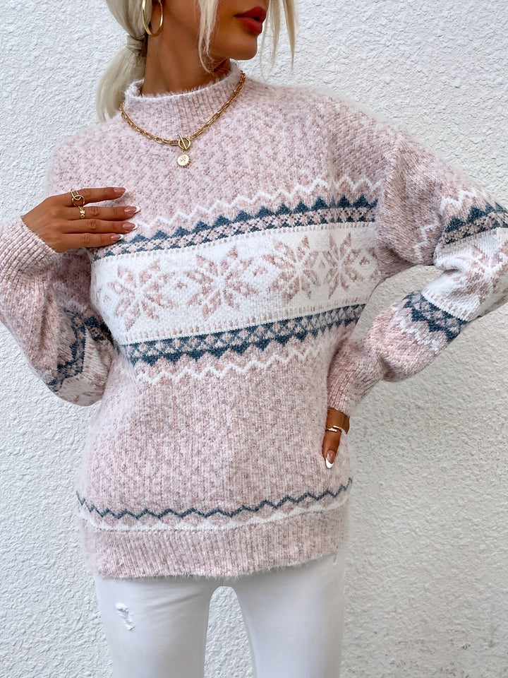 Pink marl snowflake jumper paired with a peach handbag accessory