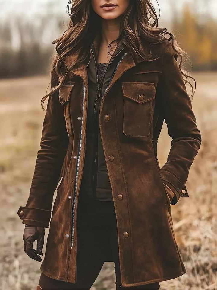 Woman wearing distressed brown suede coat with button pockets and notch lapel