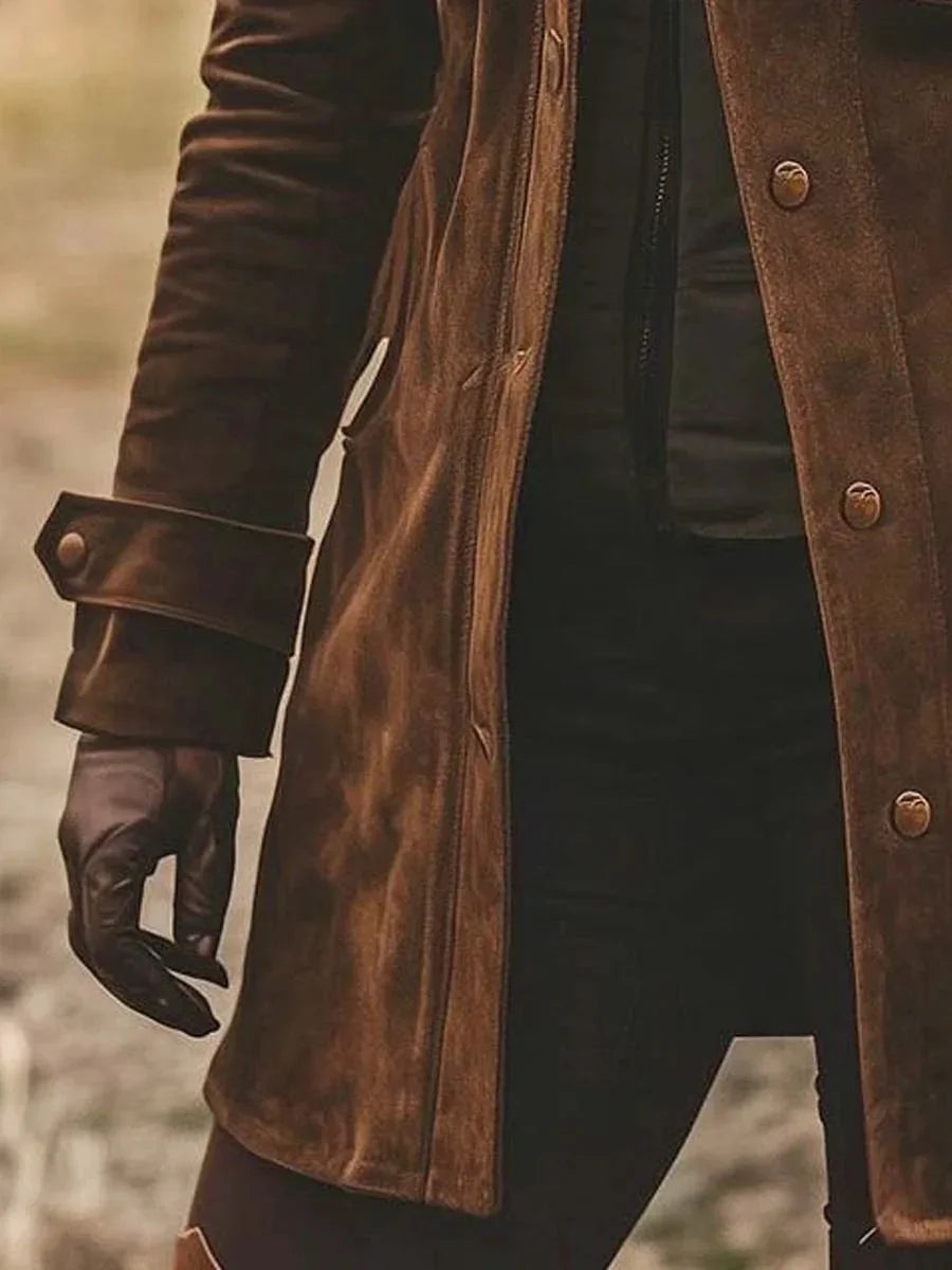 Side view of brown suede coat showing zip fastening and cuffed sleeve