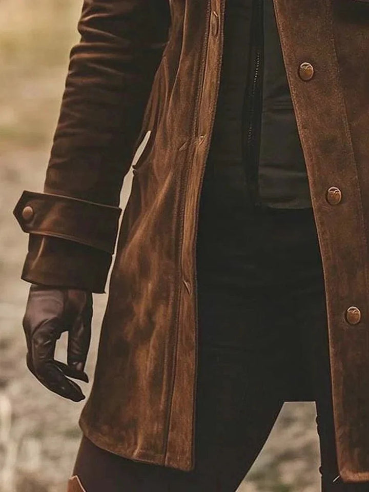 Side view of brown suede coat showing zip fastening and cuffed sleeve