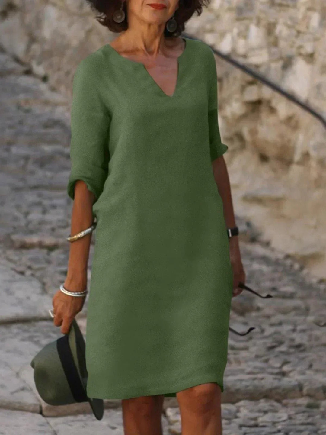 Olive green notch V-neck shift dress with three-quarter sleeves