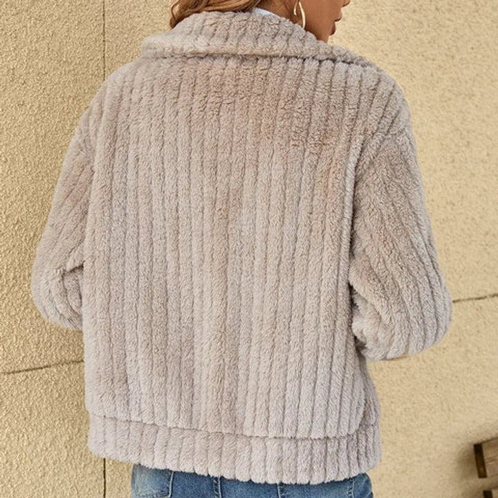Rear view of grey ribbed fleece jacket showing plush textured fabric