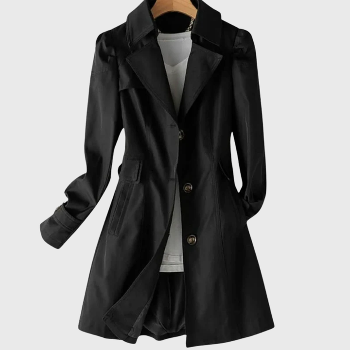 Black single-breasted trench coat with tortoiseshell buttons and belted waist