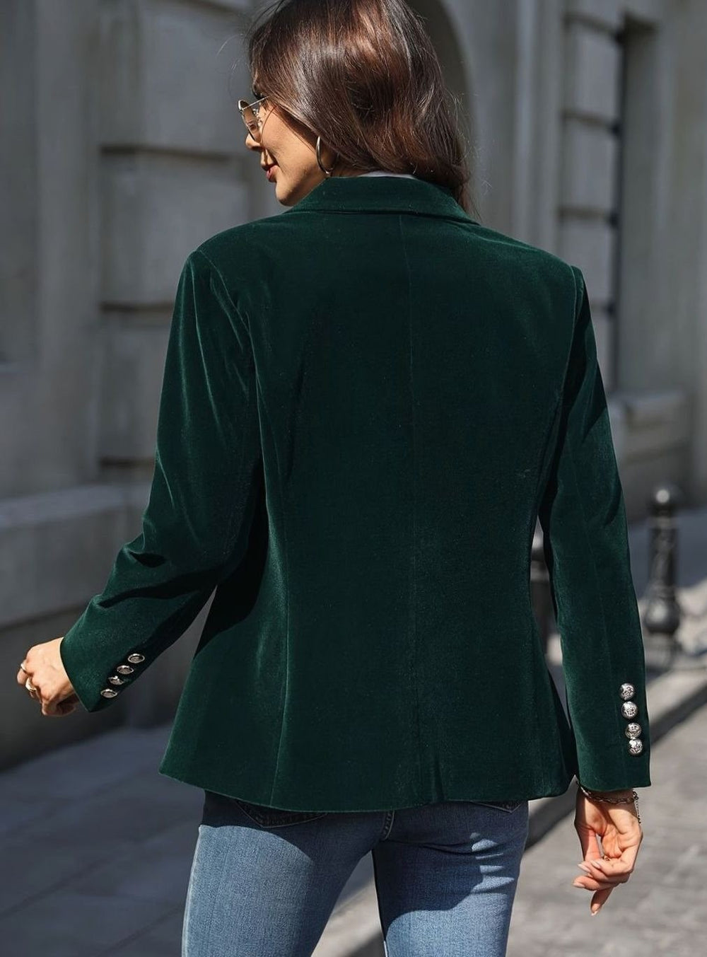 Emerald green velvet blazer back view showing tailored fit and button cuffs