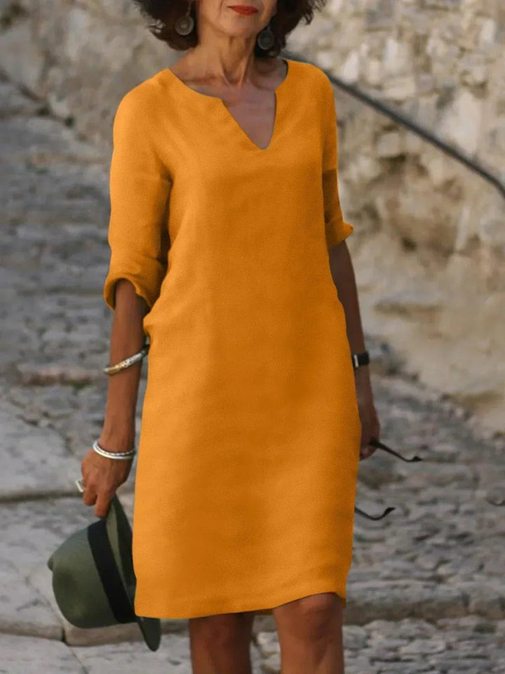 Mustard yellow notch-neck shift dress with casual half sleeves
