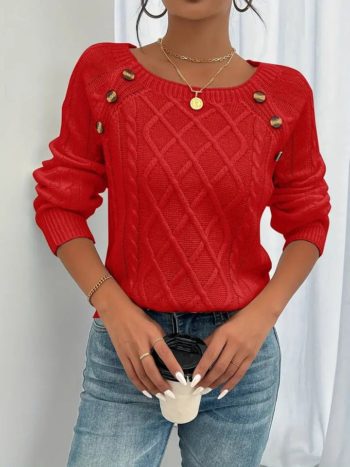 Red cable knit jumper featuring button detail across square neckline
